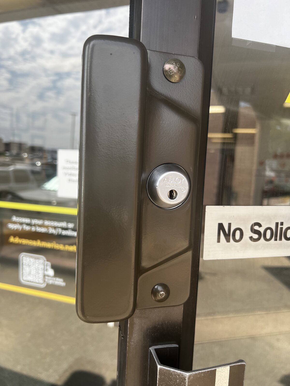 Abloy hardened high-security cylinder and security trim on a storefront door