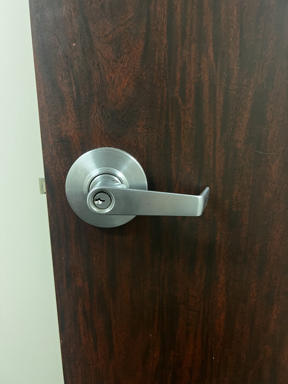Commercial lever handle lock installed on an office door in Houston