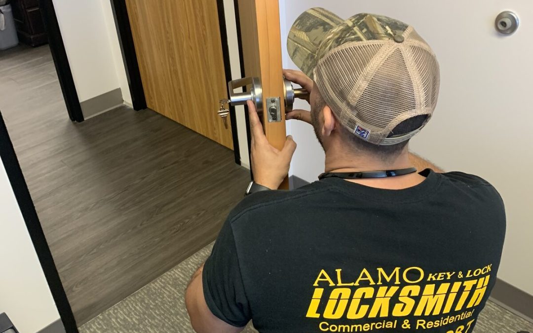 Alamo Key & Lock locksmith installing a lever lock on an office door in Houston