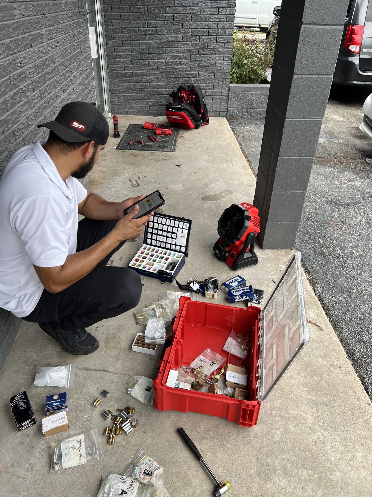 Locksmith pinning lock cylinders on site for a master key system in Houston